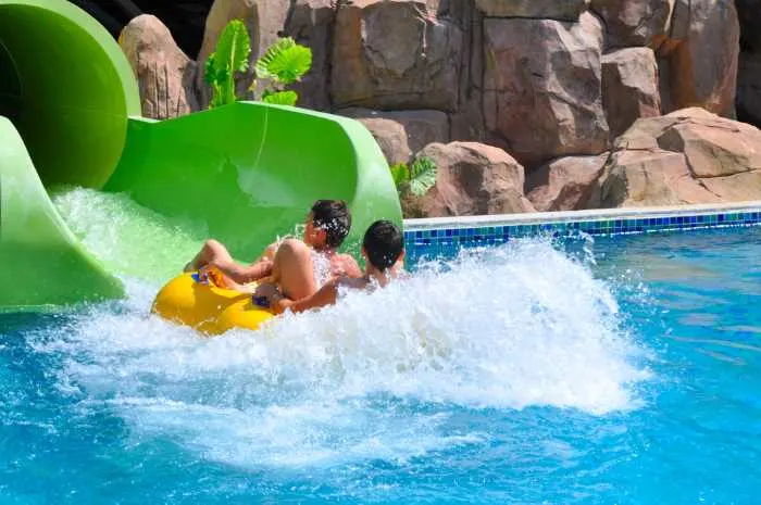 coming down a water slide on an innertube.