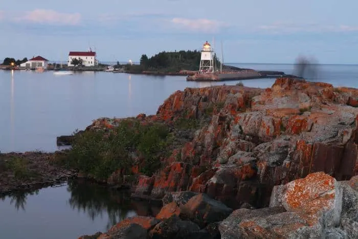 Rocks and lighthouse on lake