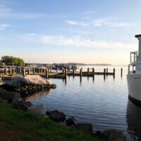 Boat docked on lakeshore