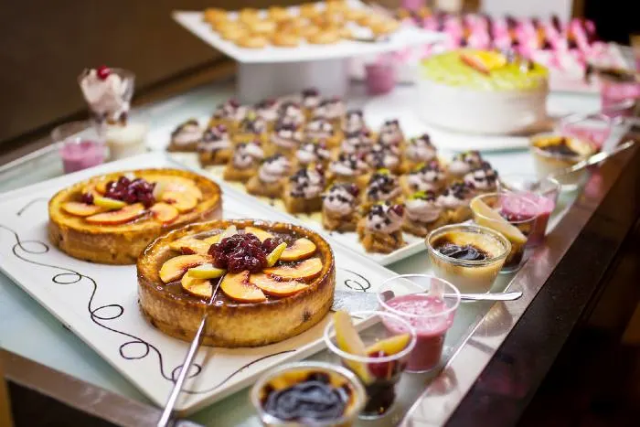 Cakes and pastries on a buffet table at one of the best steakhouses in Minnesota