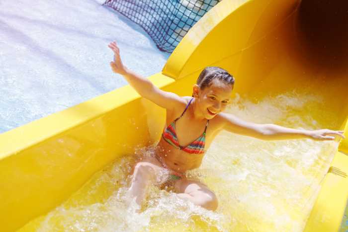 girl on waterslide at an indoor waterpark
