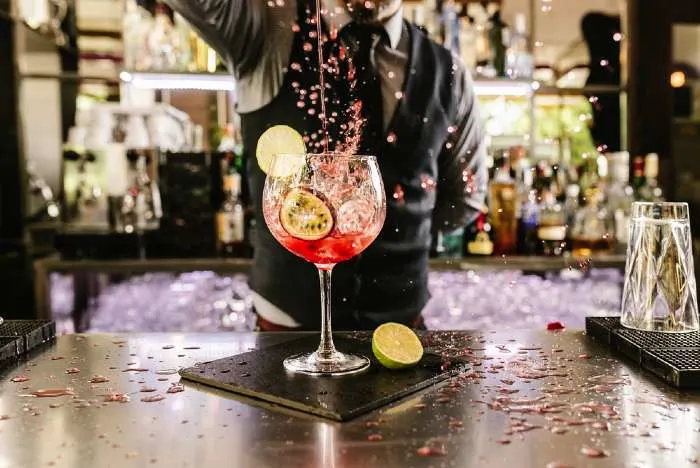 Specialty cocktail being made by bartender