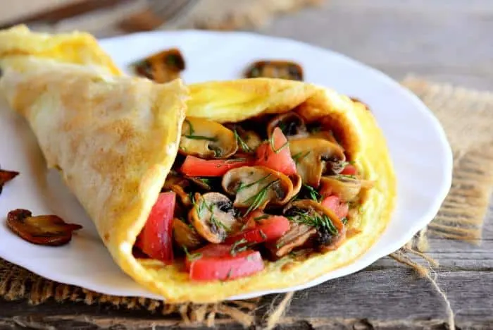 Enjoy a mushroom and tomato omelet as some food in Minnesota.