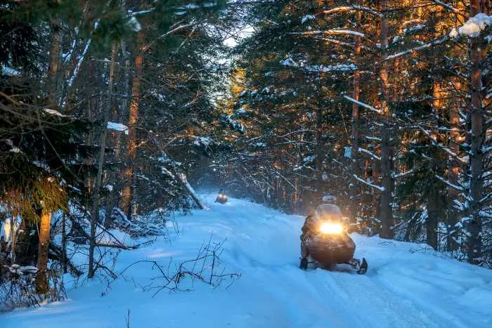 snowmobile riding in the winter at one of the best lake resorts in Minnesota
