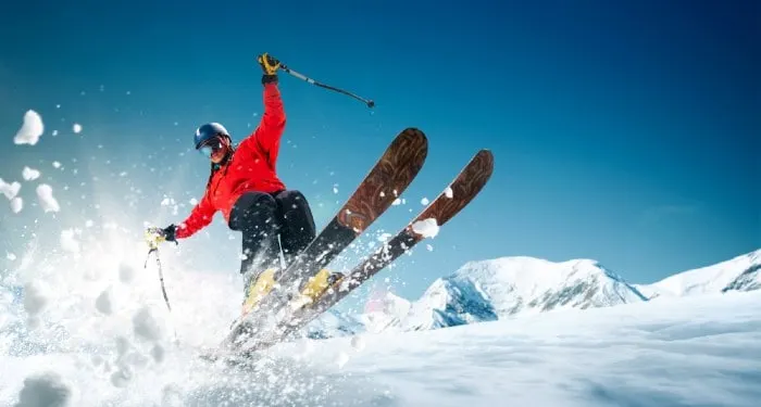 Jumping skier on fresh snow