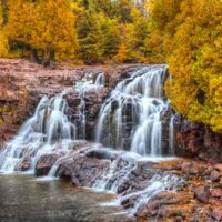 Water fall in colorful fall foliage forest