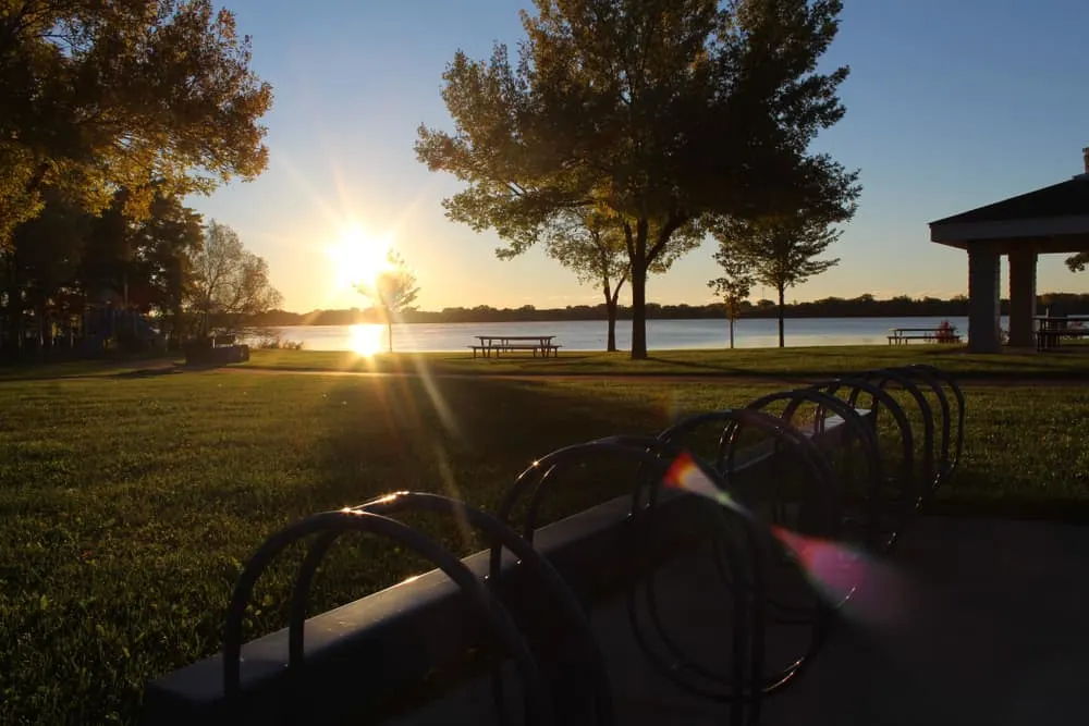 Lake with Pavillion, grass area, and bike rack