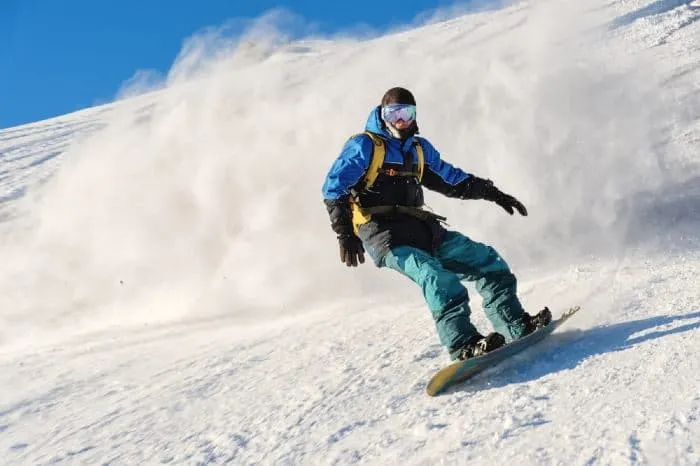 A snowboarder enjoying an adventurous slope