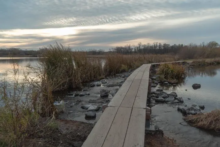 Beautiful sunset and wood trail at Purgatory Creek Park in Minnesota
