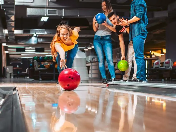 Friends having fun while bowling