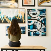 Visitor admiring wall of art