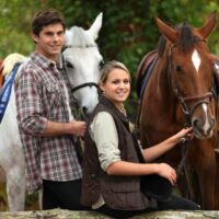 Young people horse riding