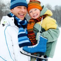 Man and son ice skating