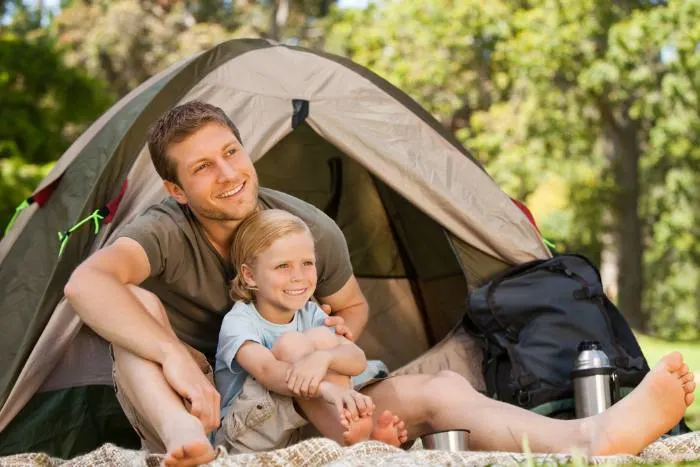 Father and his son camping at one of the fun things to do in Cloquet
