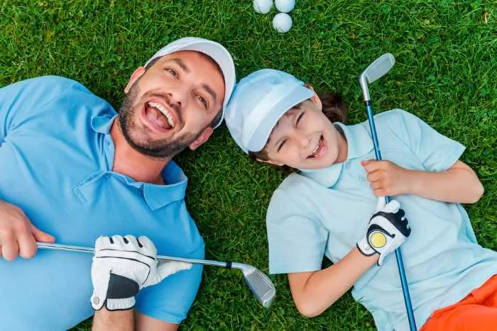 Father and son happy while golfing