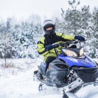 Man Snowmobiling
