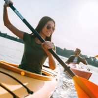 A couple kayaking on water