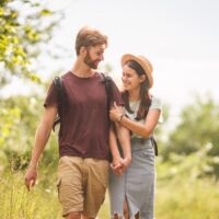Young couple walking in park