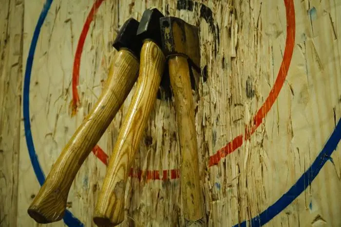 Axe stick in to the wood bull's eye in throwing axe sport
