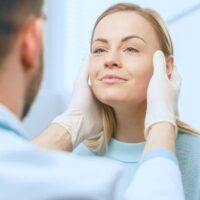 Woman with cosmetic surgeon