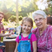 Grandmother and granddaughter at picnic