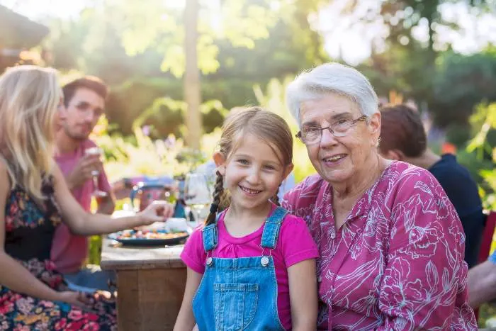 Family picnic closeup on a grandmother and her granddaughter
