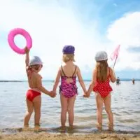 Young girls on lake beach