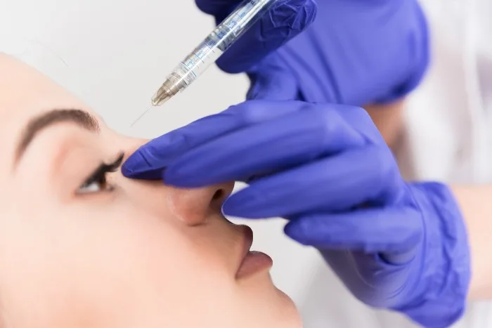Woman having a nonsurgical nose job