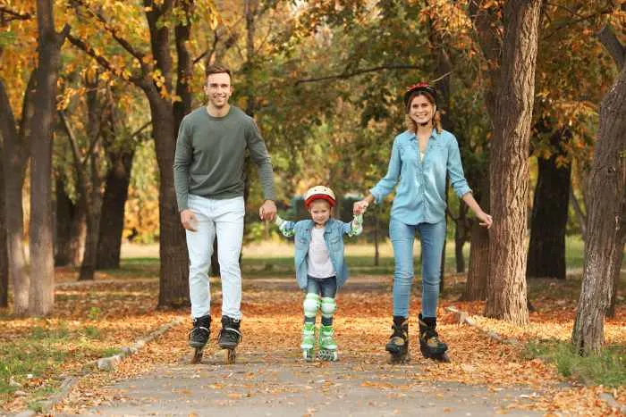 Happy family rollerblading; one of the most fun things to do in Sauk Rapids, Minnesota
