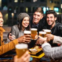 Friends toasting with beer
