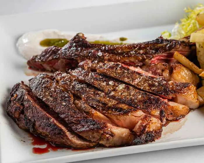 NY Strip Steak grilled with asparagus from one of the best steakhouses in Minneapolis
