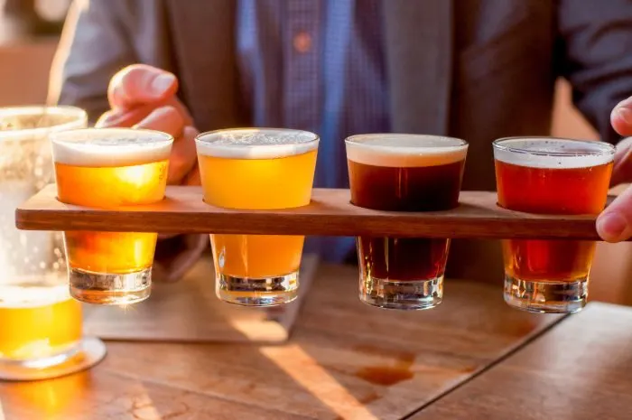 Selection of craft beers in a flight, ready for tasting at one of the great things to do in New Ulm
