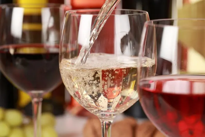 White wine pouring into a wine glass