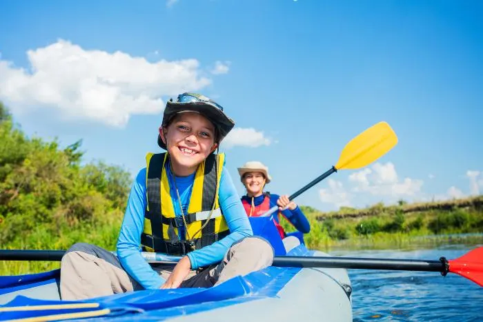 Two boys Spending the afternoon paddling on the water 