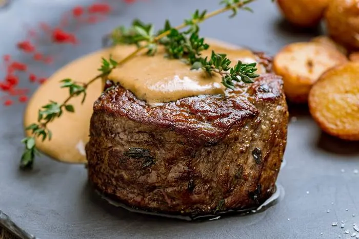 A grilled steak filet Mignon with special cream sauce