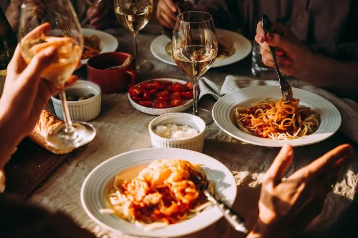 Friends having a pasta dinner