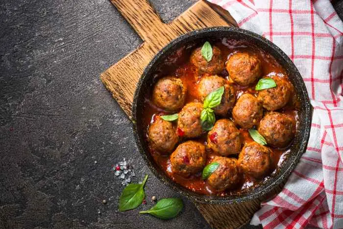 Meatballs in tomato sauce in a frying pan