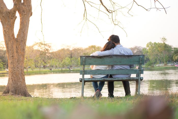 couple sitting on a bench in the garden