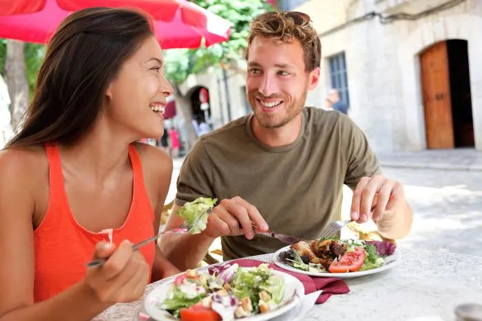 Restaurant tourists couple eating at an outdoor cafe