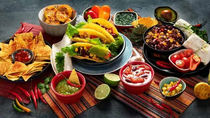 Mexican food, many dishes of the Mexican cuisine on dark background
