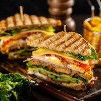 Tall club sandwich and fries