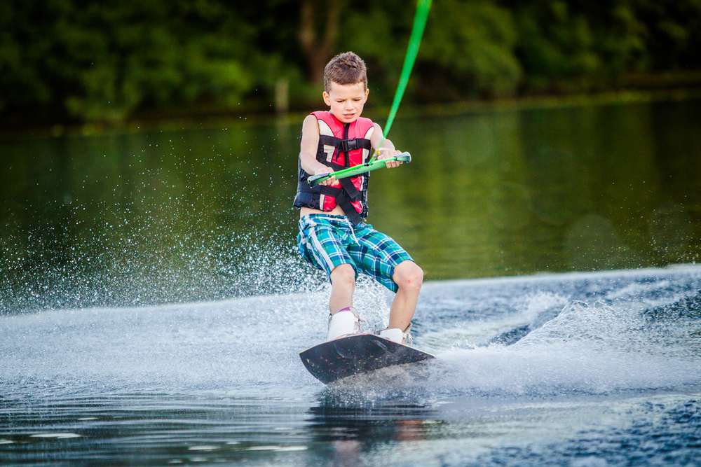 A child riding in the Wakeboarding