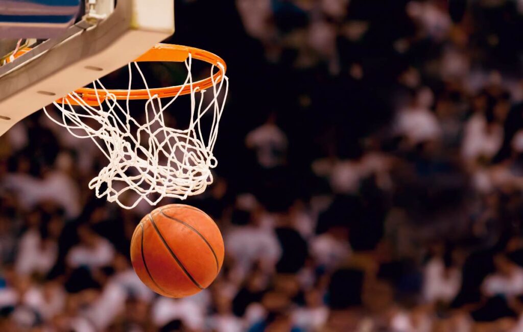 Scoring the winning points at a basketball game
