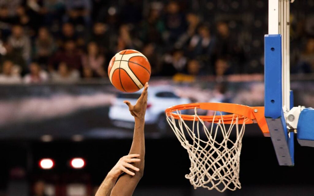 scoring during a basketball game - ball in hoop
