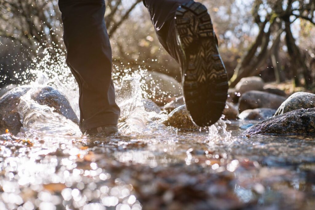 Man walking through water.