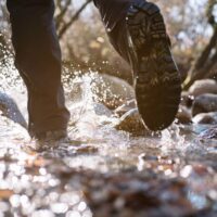 Man walking through water.