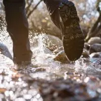 Man walking through water.