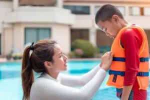 A child wearing the best life jacket for kids.