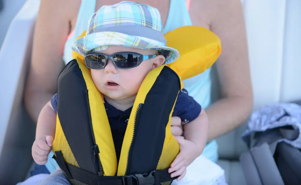 Baby perhaps wearing a best infant life jacket.