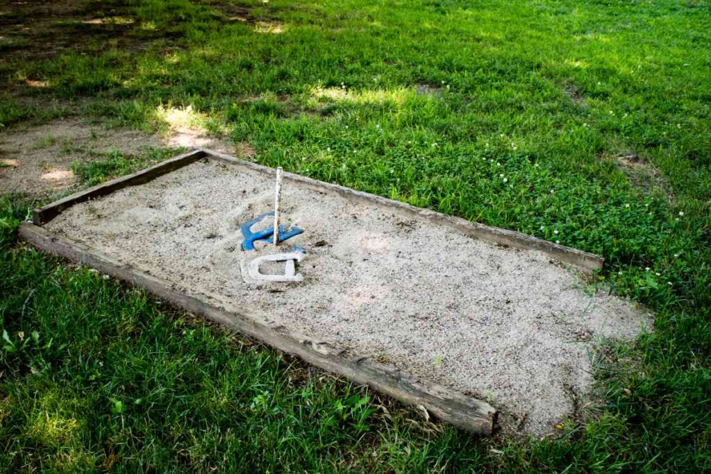 Playing horseshoes at William O'Brien State Park